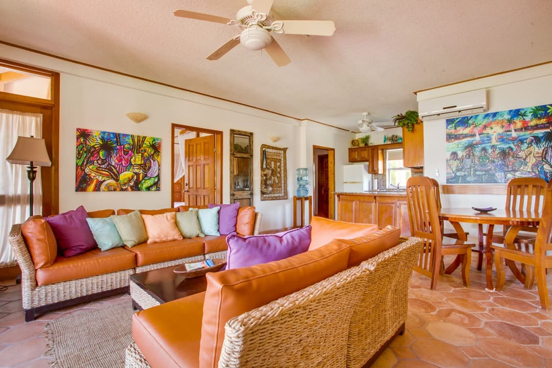 Living, dining and kitchen areas in an oceanfront two-bedroom executive suite