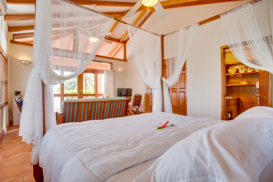 King bed and sitting area in a one-bedroom suite