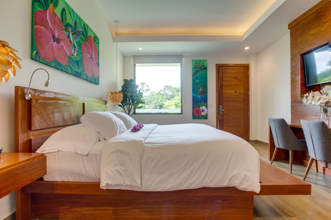 King bed, desk and window in a boutique room