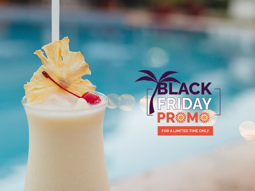 A tropical cocktail garnished with pineapple and cherry, beside a pool, featuring a "Black Friday Promo" banner. A tropical cocktail garnished with pineapple and cherry, beside a pool, featuring a "Black Friday Promo" banner.