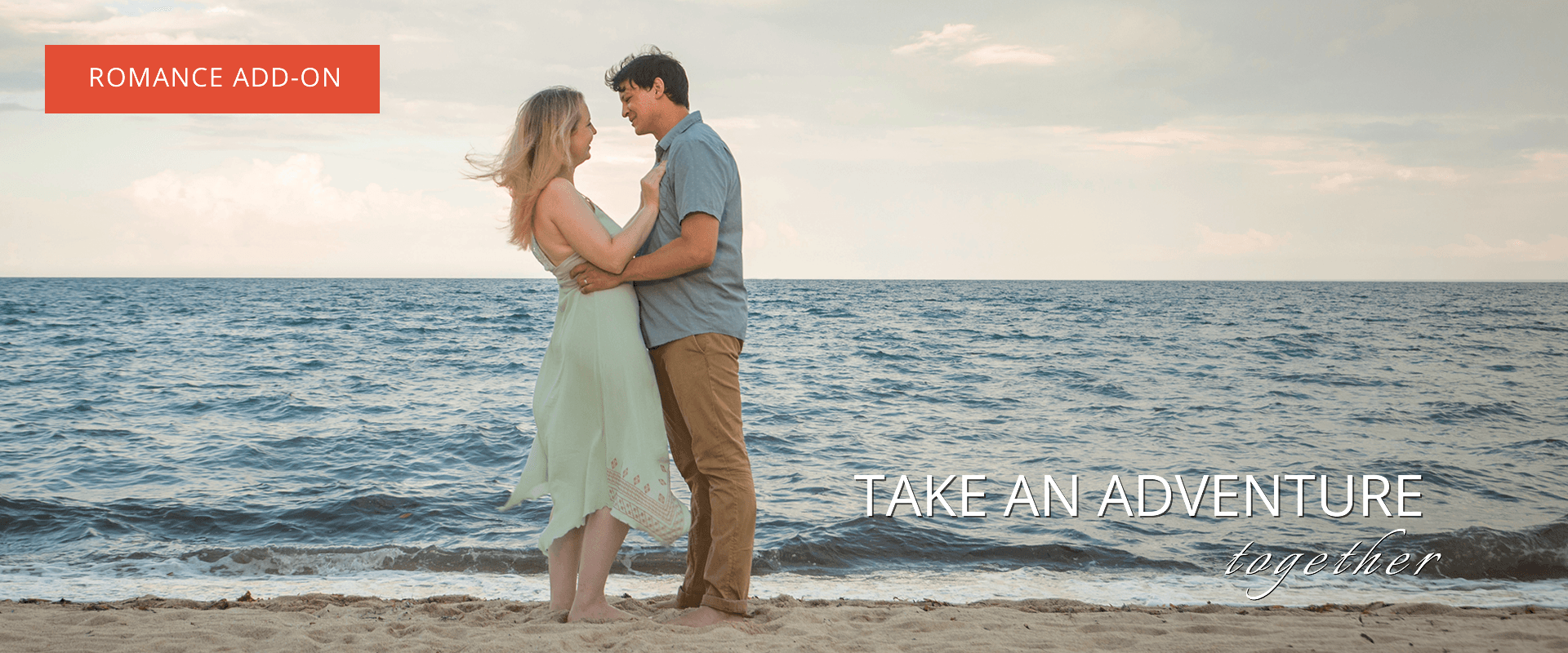 Man and woman standing in the sand at the ocean edge. Text says "Romance Packages" and "Take an adventure together"