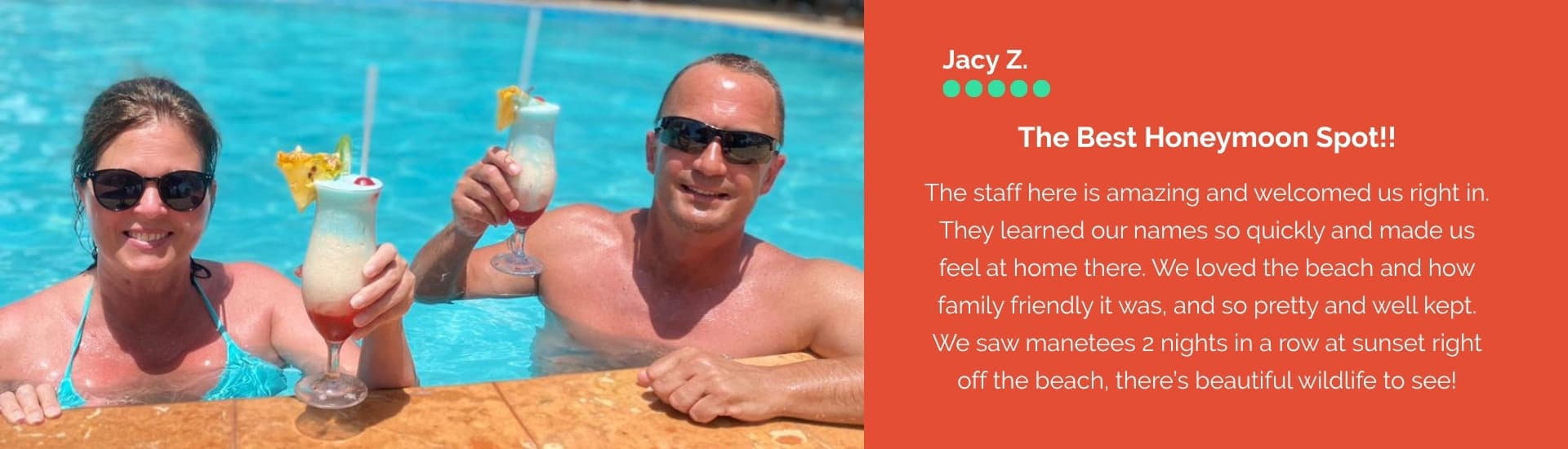 A couple enjoys tropical drinks by a pool, smiling in sunglasses.