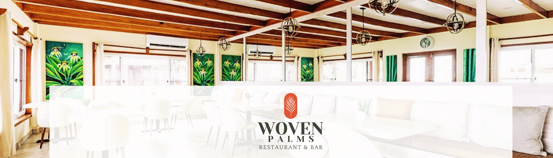 Bright and airy restaurant interior featuring tropical-themed decor and a modern seating area.