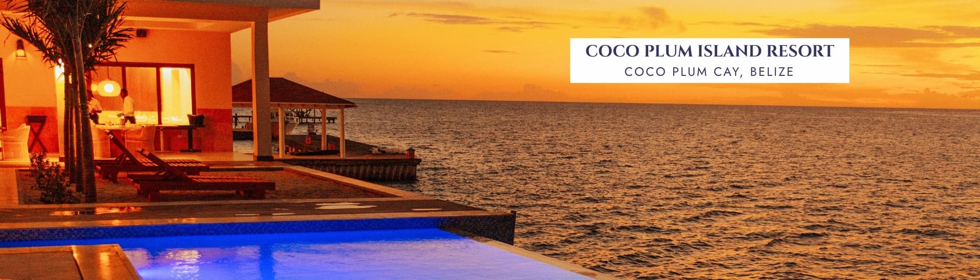 A serene sunset view over the ocean with an infinity pool in front of a resort.