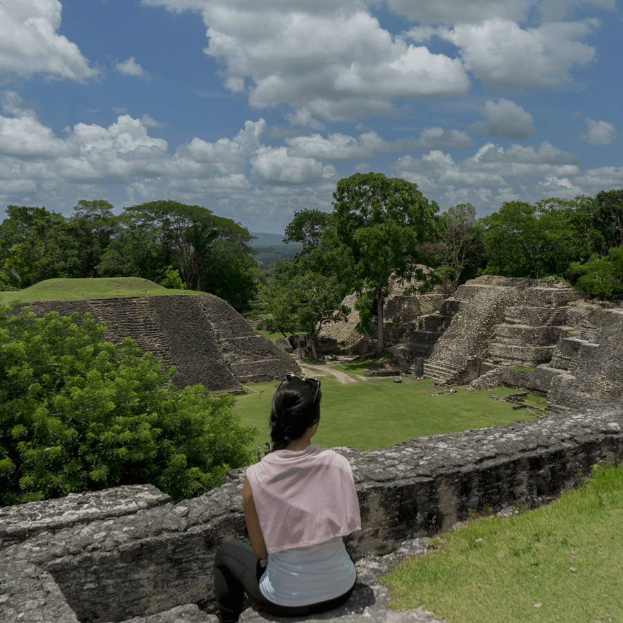 Guest overlooking Mayan ruins and rainforest