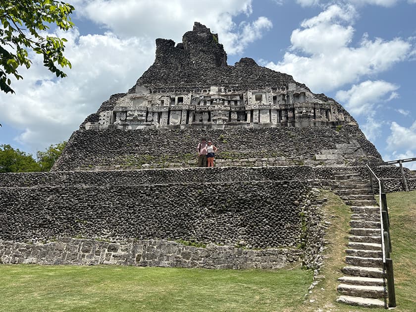 Couple in fromt of Mayan ruin in Belize.