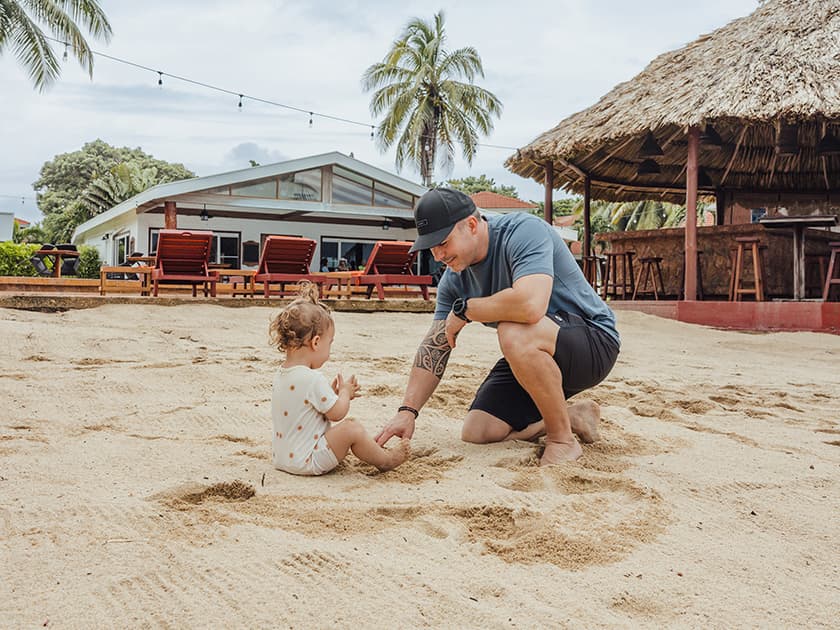 Dad with his daughter playing in the sand. Dad with his daughter playing in the sand.