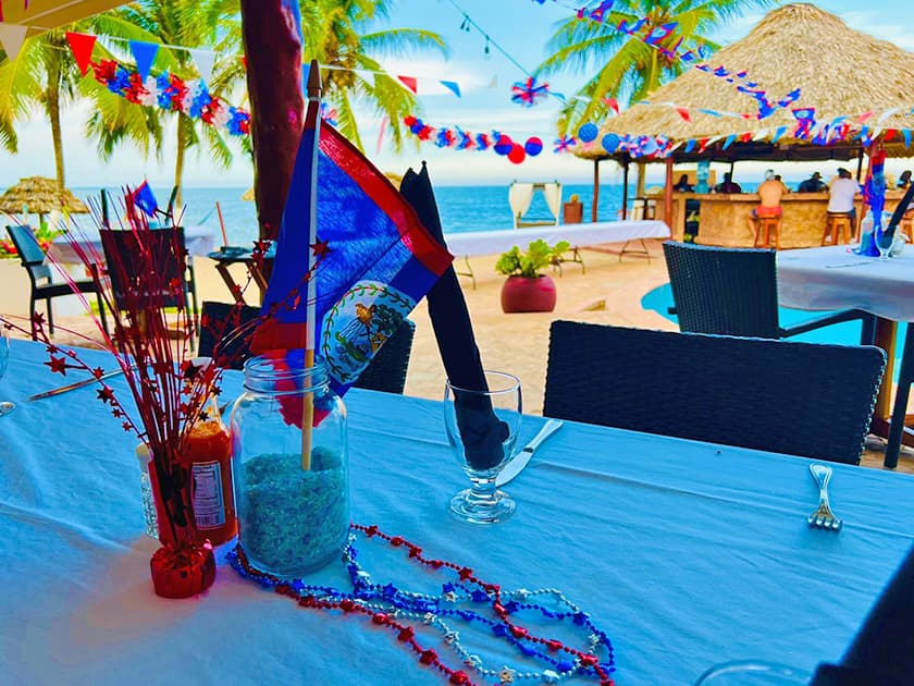 Poolside views of colorful table during Belize September celebrations.