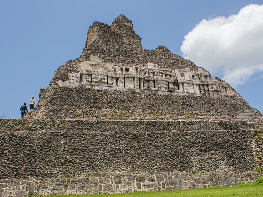 Adventure travelers climbing Xunantunich Maya Ruin in Belize. Adventure travelers climbing Xunantunich Maya Ruin in Belize.